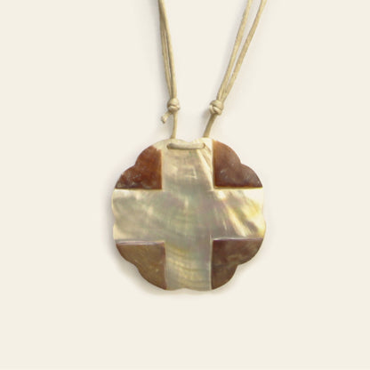 Closeup of light-toned mother of pearl pendant necklace with beige cotton cord – Nayabijou.