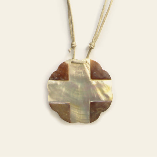 Closeup of light-toned mother of pearl pendant necklace with beige cotton cord – Nayabijou.