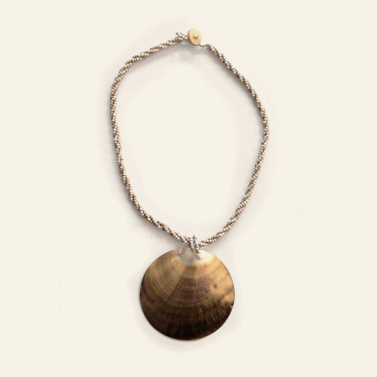 Handmade round bronze-toned shell necklace with beige seed beads – Nayabijou.