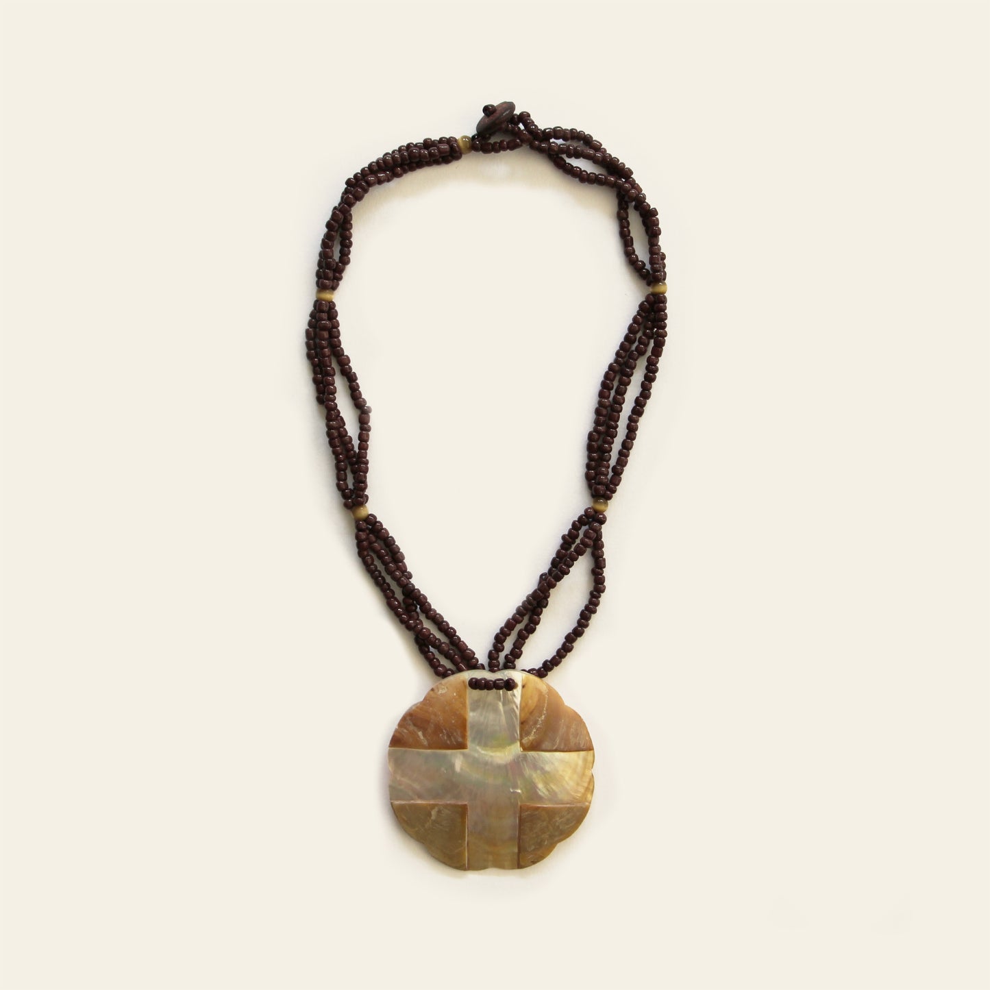 Warm-toned mother of pearl pendant necklace with dark brown seed bead strands – Nayabijou