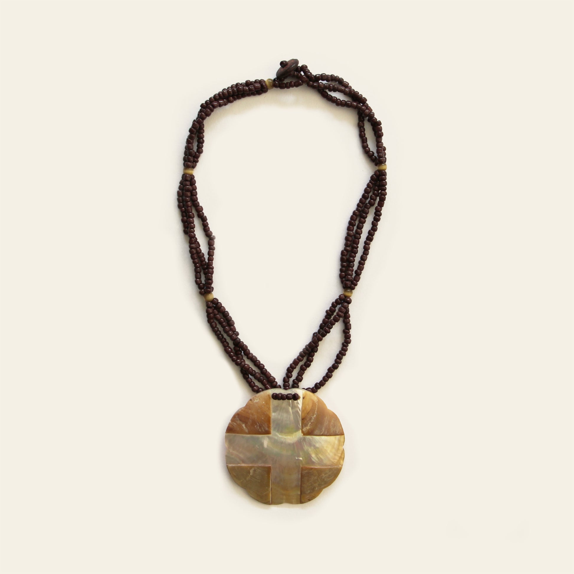 Warm-toned mother of pearl pendant necklace with dark brown seed bead strands – Nayabijou