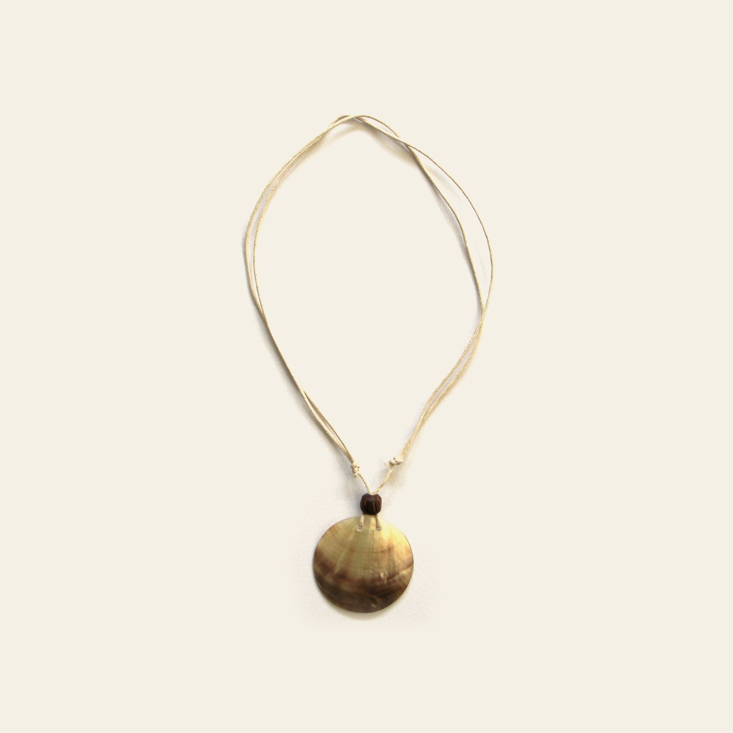 Handmade necklace with beige cord and round natural Mother of Pearl pendant – Nayabijou.