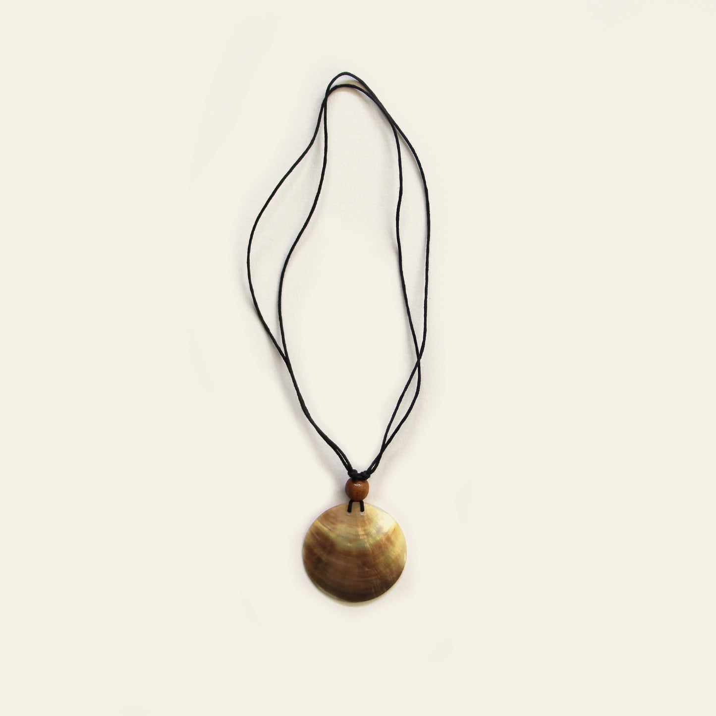 Handmade necklace with black cord and round natural Mother of Pearl pendant – Nayabijou.