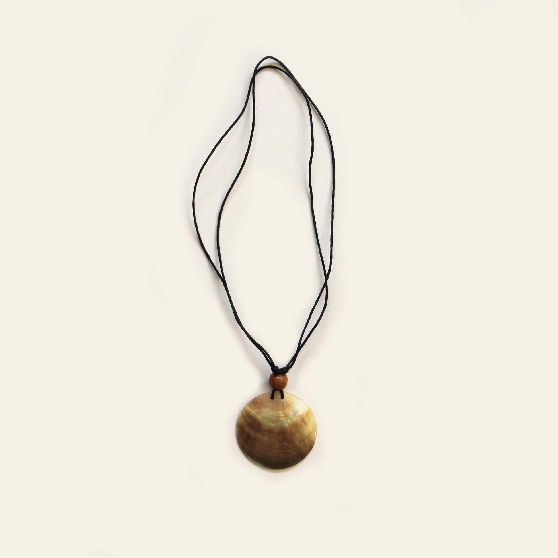 Handmade necklace with black cord and round natural Mother of Pearl pendant – Nayabijou.