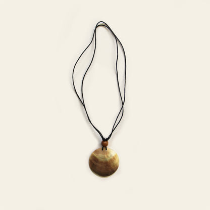 Handmade necklace with black cord and round natural Mother of Pearl pendant – Nayabijou.