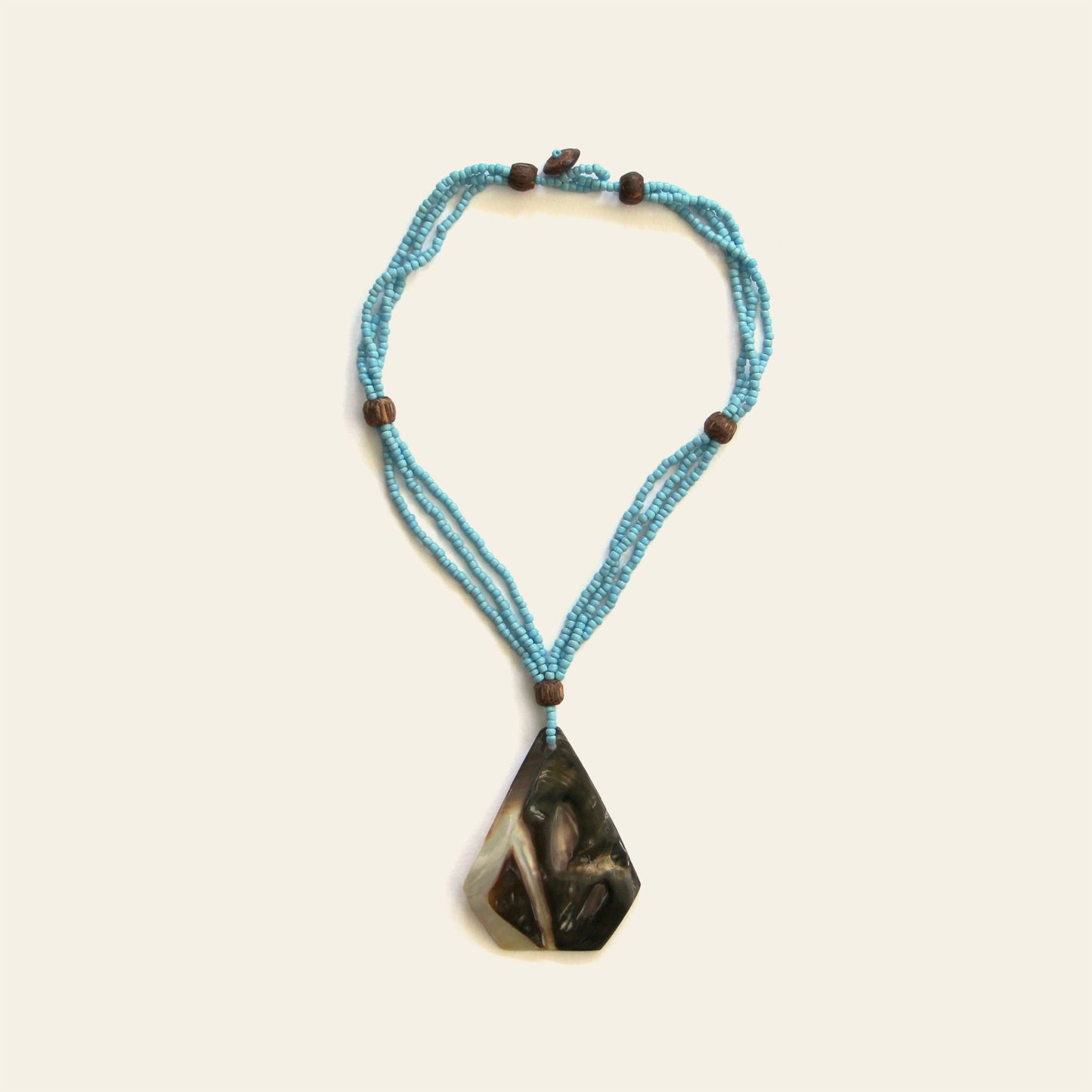 Handmade necklace turquoise with triangular mother of pearl shell pendant and beaded strands – Nayabijou.