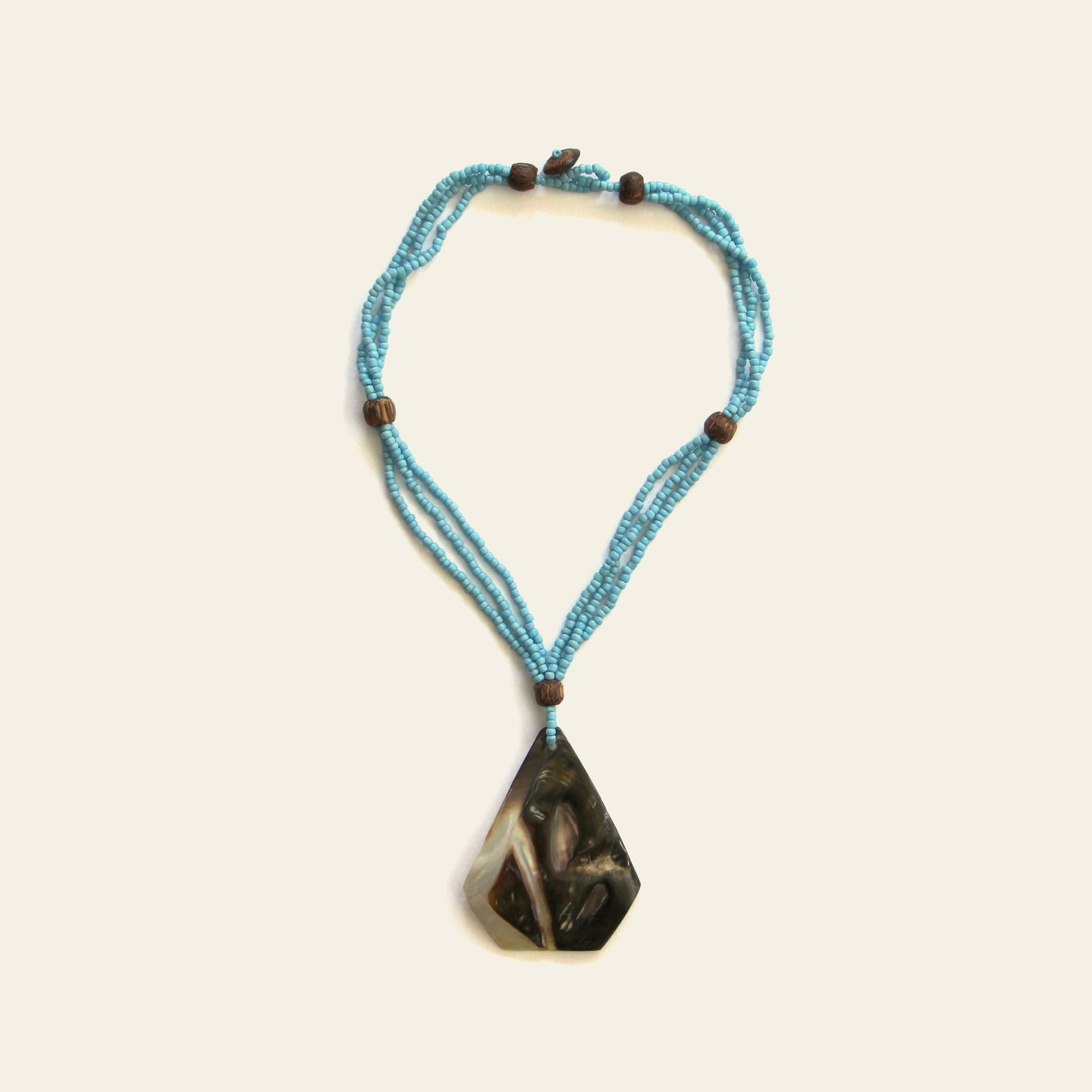 Handmade necklace turquoise with triangular mother of pearl shell pendant and beaded strands – Nayabijou.