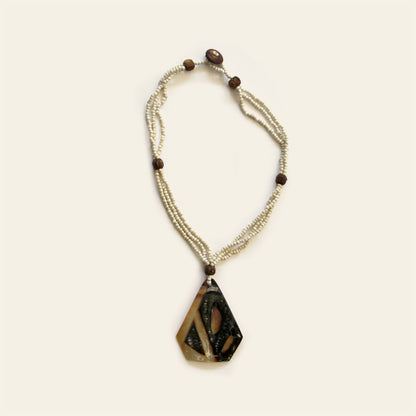 Handmade necklace with triangular mother of pearl shell pendant and beaded strands – Nayabijou.