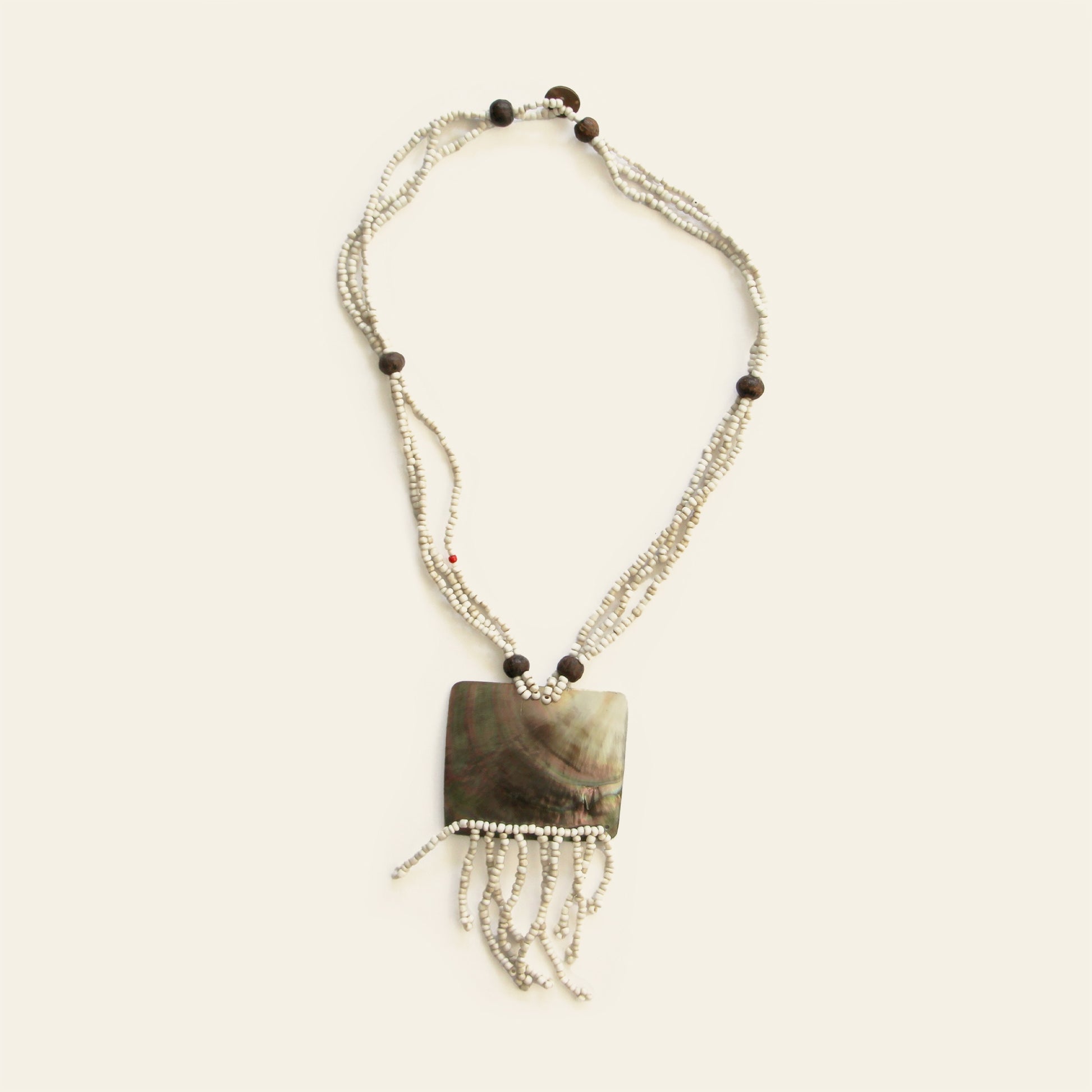 Full view of rectangular mother-of-pearl pendant necklace with ivory beads and beaded fringe – Nayabijou.